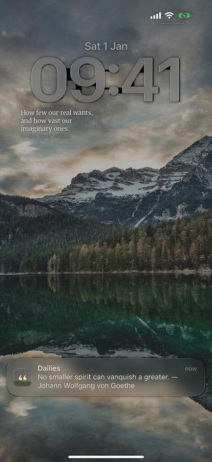 An iPhone Lock Screen showing a Dailies notification reading: No smaller spirit can vanquish a greater. Johann Wolfgang von Goethe.