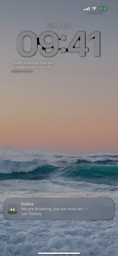 An iPhone Lock Screen showing a Dailies notification reading: We are drowsing, but we must act. Leo Tolstoy.